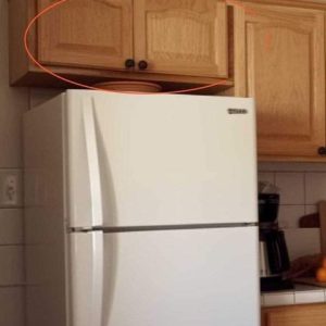 Here’s what the cupboards above your fridge are for Here’s what the cupboards above your fridge are for
