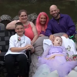 Brave little girl wheeled down the aisle by dad to marry school sweetheart days before passing away