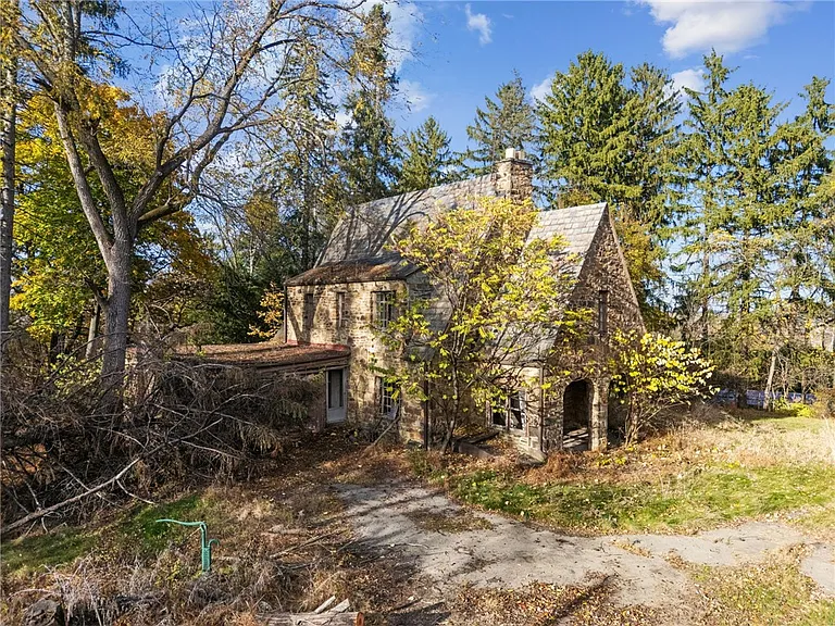 Elegant Tudor Home with Spacious Lot and Renovation Potential